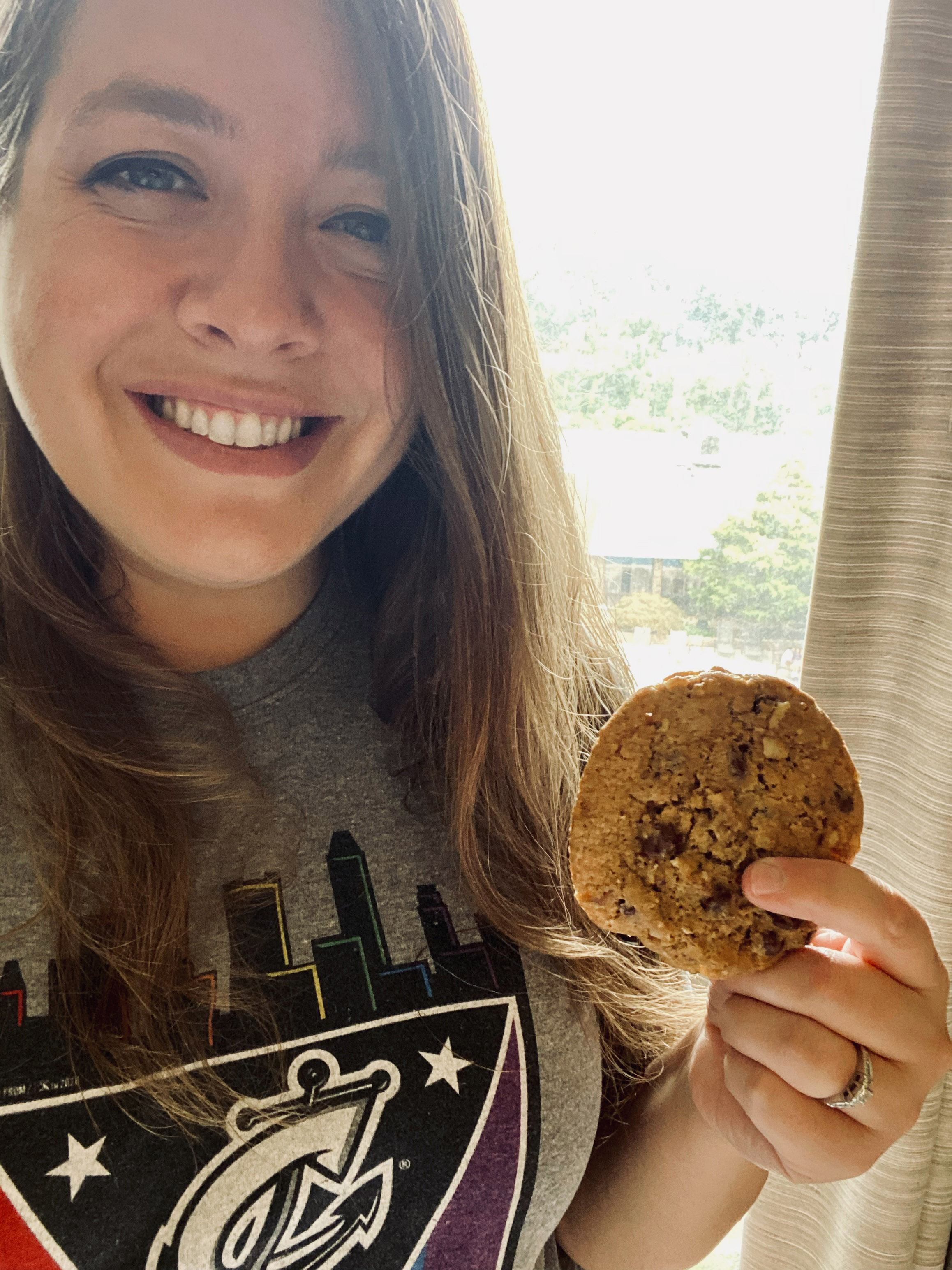 Sarah Allgire holds up a DoubleTree cookie.